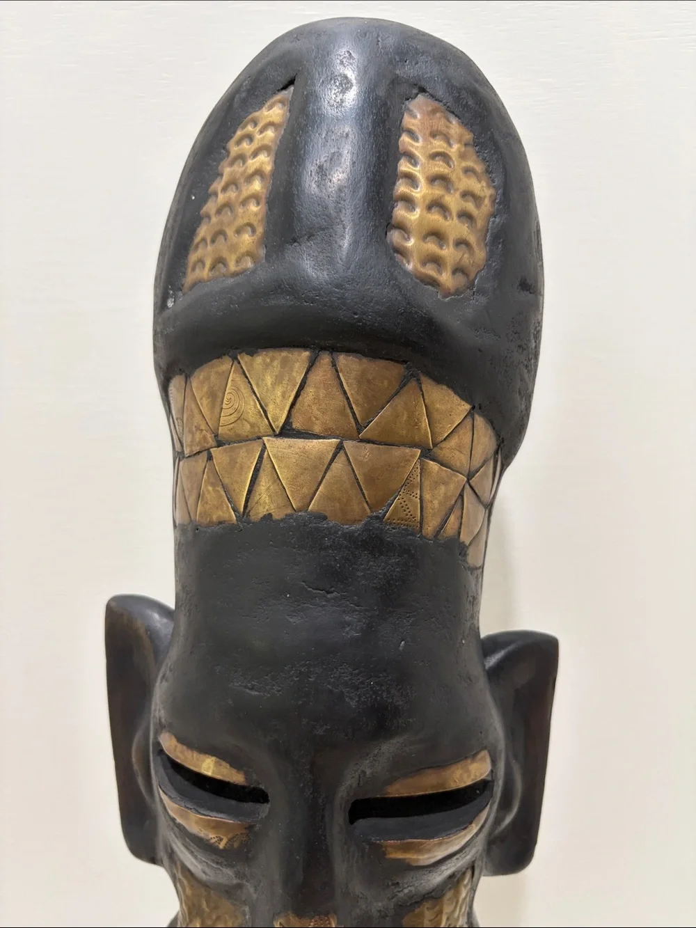 Hand-Carved Black and Brass Tribal Mask from Ghana